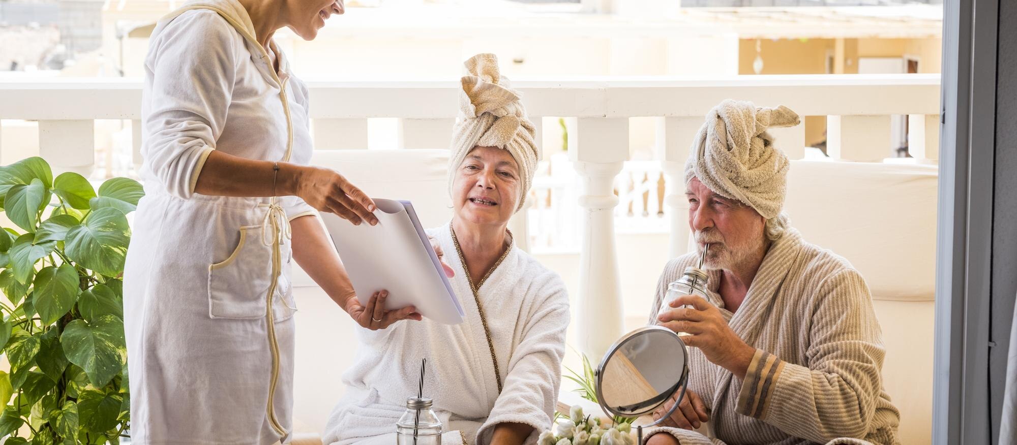 couple two healthy happy seniors taking having fun using massage treatment service with assistent 81